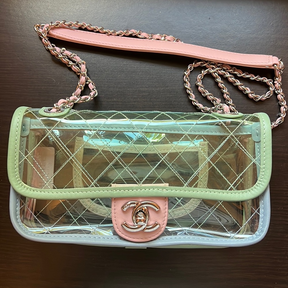 Brand new plastic beach bag. With leather trims